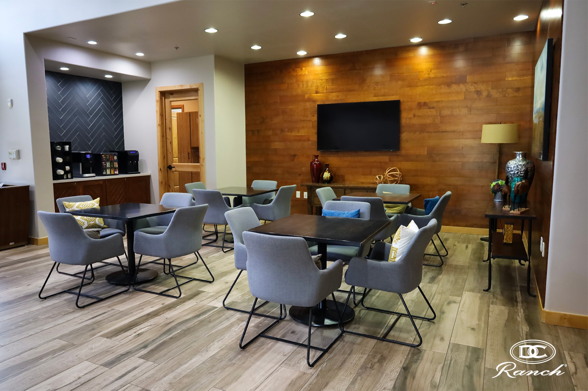 Homestead lobby / lounge — existing informal seating, coffee station, wood accent wall